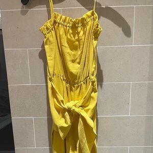 Bcbg generation yellow full length romper with front belt tie. Never worn.